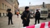 Police guard the entrance to the subway station in St. Petersburg where 14 people were killed on April 3.