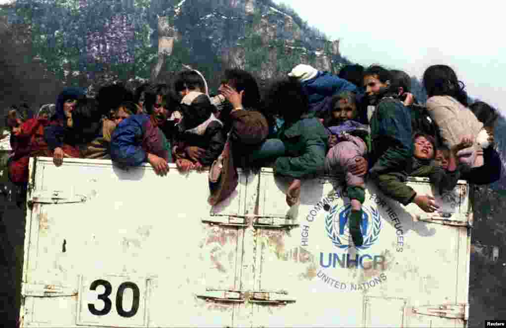 Bosnian Muslim refugees are packed into a UNHCR truck on March 31, 1993, during the evacuation of the besieged town of Srebrenica. An enclave in the east of the town was designated a U.N. safe haven, but four months later, in July, more than 8,000 Muslim men and boys would be slaughtered in Europe's worst massacre since World War II.