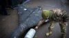  A Ukrainian soldier shows a Russian drone with a thermobaric charge that was downed in Ukraine in November.