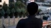 A young gay Afghan poses with his back to the camera in Kabul. (file photo) 