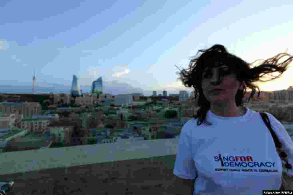 This woman sports a pro-democracy T-shirt. Many activists used the media attention surrounding Eurovision to raise concerns about Azerbaijan's human rights record.
