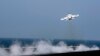 Сириялык учакты атып түшүргөн F/A-18E Super Hornet аттуу америкалык кыргыч учак. AFP. 