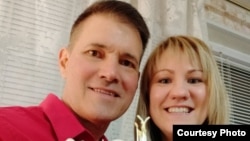 Gaylen Grandstaff -- or Bear -- and his wife, Anna, at their Moscow apartment in April, 2019.