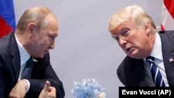 U.S. President Donald Trump (right) and Russian President Vladimir Putin speak at the G20 summit in Hamburg in July 2017.