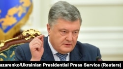 Ukrainian President Petro Poroshenko made the announcement at a meeting of the National Security and Defense Council in Kyiv on December 26. 
