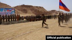 Tajikistan - Armenian soldiers march during a CSTO military exercise near the Afghan border, 19May2015.