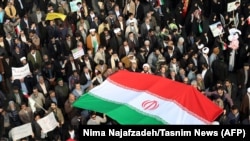 Pro-government supporters march during a rally in support of the regime in the city of Mashhad on January 4.