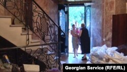 Nunu Chovelidze, her children, and her grandchildren have lived in this former casino in Tbilisi for the last nine years.
