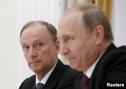 Russian Security Council Secretary Nikolai Patrushev (left) and President Vladimir Putin