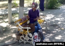 A woman smokes in Turkmenistan. Many stores refuse to sell cigarettes to women.