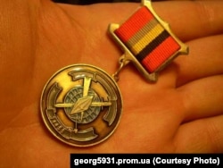 Russian medal with emblem of GRU military unit No. 74455