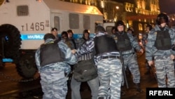 Riot police, with a shiny new truck, breaking up a demonstration against election falsification in Moscow in October.