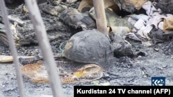 An image grab taken from the Kurdistan 24 TV channel shows damage following a deadly rocket attack on February 15 targeting a military complex inside the Irbil airport that hosts foreign troops deployed as part of a U.S.-led coalition.