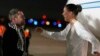 US-Russian dual national Ksenia Karelina greets her fiancé, professional boxer Chris van Heerden, as she arrives Thursday, April 10, 2025, at Joint Base Andrews, Md.