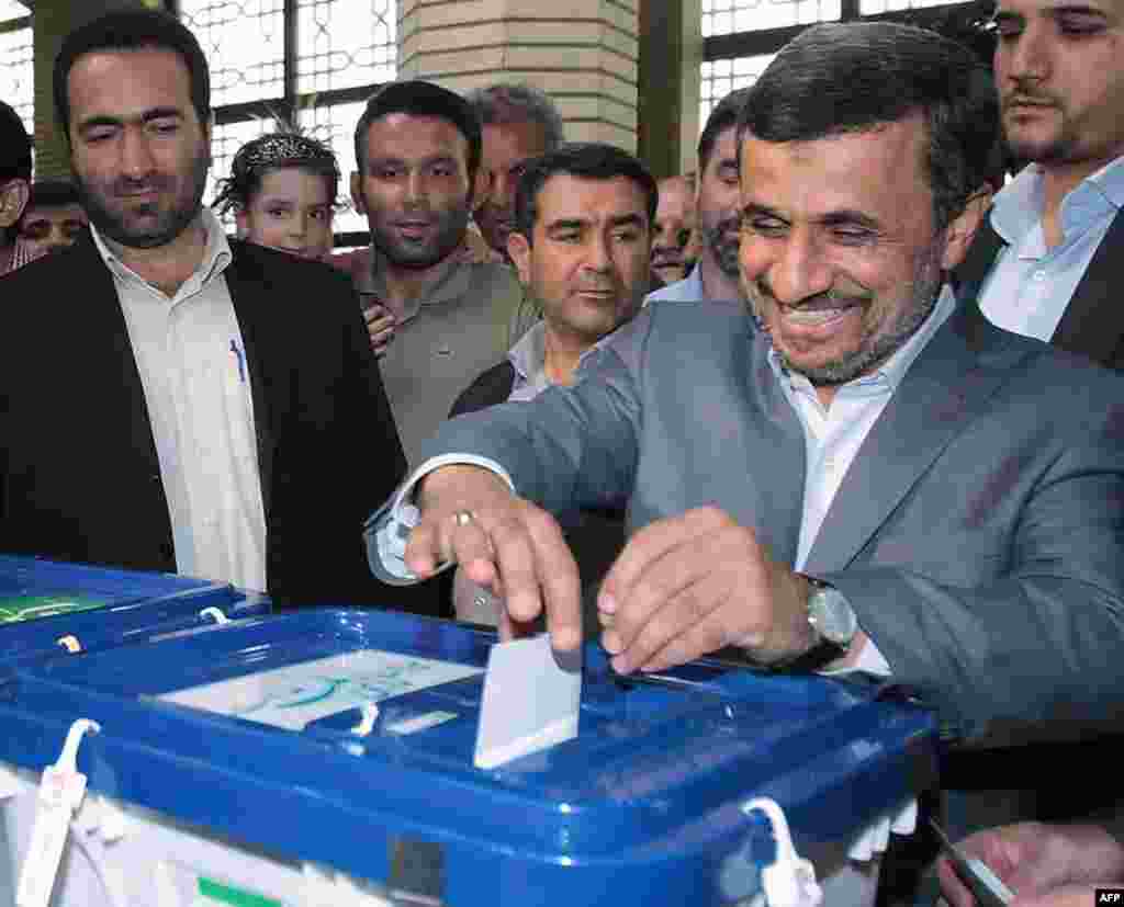 Rohani is due to replace Mahmud Ahmadinejad, seen here casting his ballot at a polling station in southern Tehran, in the presidency.