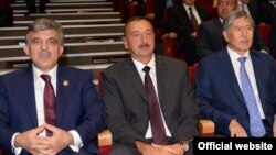 Turkish President Abdullah Gul (left), Azerbaijani President Ilham Aliyev (center), and Kyrgyz President Almazbek Atambaev attend a concert in Baku on August 15.