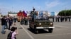 9 траўня 2021 году будучы камэндант гораду Скадоўску Херсонскай вобласьці Віктар Багатураў камандаваў вайсковым парадам у Тальяці. Скрын з трансьляцыі