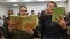 Worshippers often read from smartphones and tablets, as shipments of Bibles have been intercepted at the Russian border by customs since 2015.