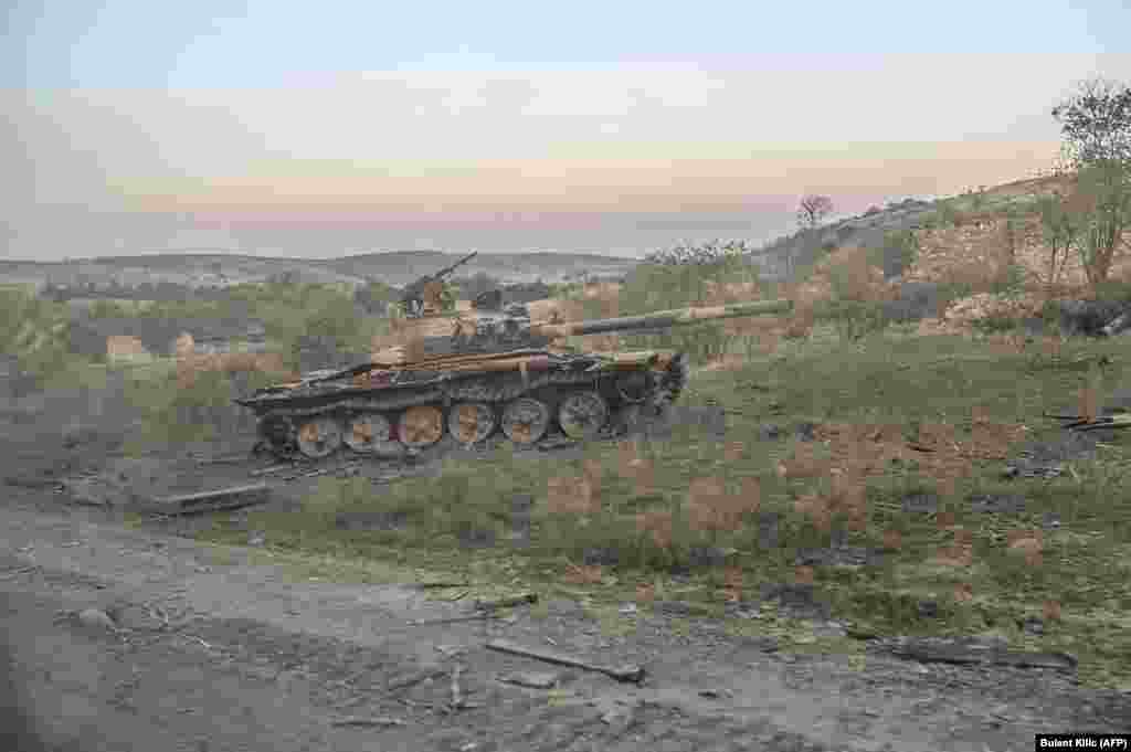 A destroyed tank in Jabrayil, after the town was captured by Azerbaijani forces, photographed from a passing car on October 16. 