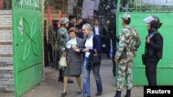 Voters at a polling station to cast ballots during the parliamentary elections in Cairo on November 29.