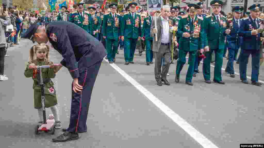 The annual Immortal Regiment march is held in Russian towns and cities, as well as in Russian-controlled Crimea, to honor those who died in World War II. Critics say the Kremlin hijacked the event after it began as a grassroots movement in 2012.&nbsp;