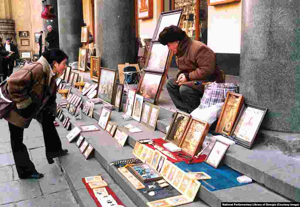 An undated photo of a street vendor selling artwork on Rustaveli Avenue. In independent Georgia, Rustaveli Avenue became a center of shopping and culture, where locals could stroll in the shade of plane trees away from the touristy old town. But with its position in front of the parliament and its potential to effectively shut down Tbilisi's traffic, “all protests, regardless of where they begin,” ultimately converge on Rustaveli, Chubinidze says. 