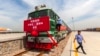 Railway workers prepare for a freight train to begin its journey from Shijiazhuang, China, to Moscow. (file photo)
