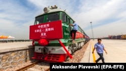 Railway workers prepare for a freight train to begin its journey from Shijiazhuang, China to Moscow, Russia. (file photo)