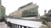 St. Petersburg's Mariinsky Second Stage (right) features soaring glass walls and a rooftop ampitheater located across the canal from the grand original theater (left).