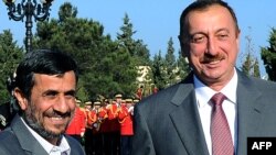 Azerbaijani President Ilham Aliyev (right) and his Iranian counterpart Mahmud Ahmadinejad meet in Baku at the beginning of the weekend summit.