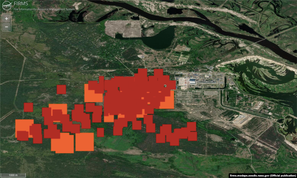 A satellite image from NASA's Fire Information for Resource Management System (FIRMS) shows the area of fire nearby Chernobyl. The Chernobyl power plant sarcophagus is seen as a silver rectangular object on the left of the map. Red and orange squares indicate the location of fires on April 13. 