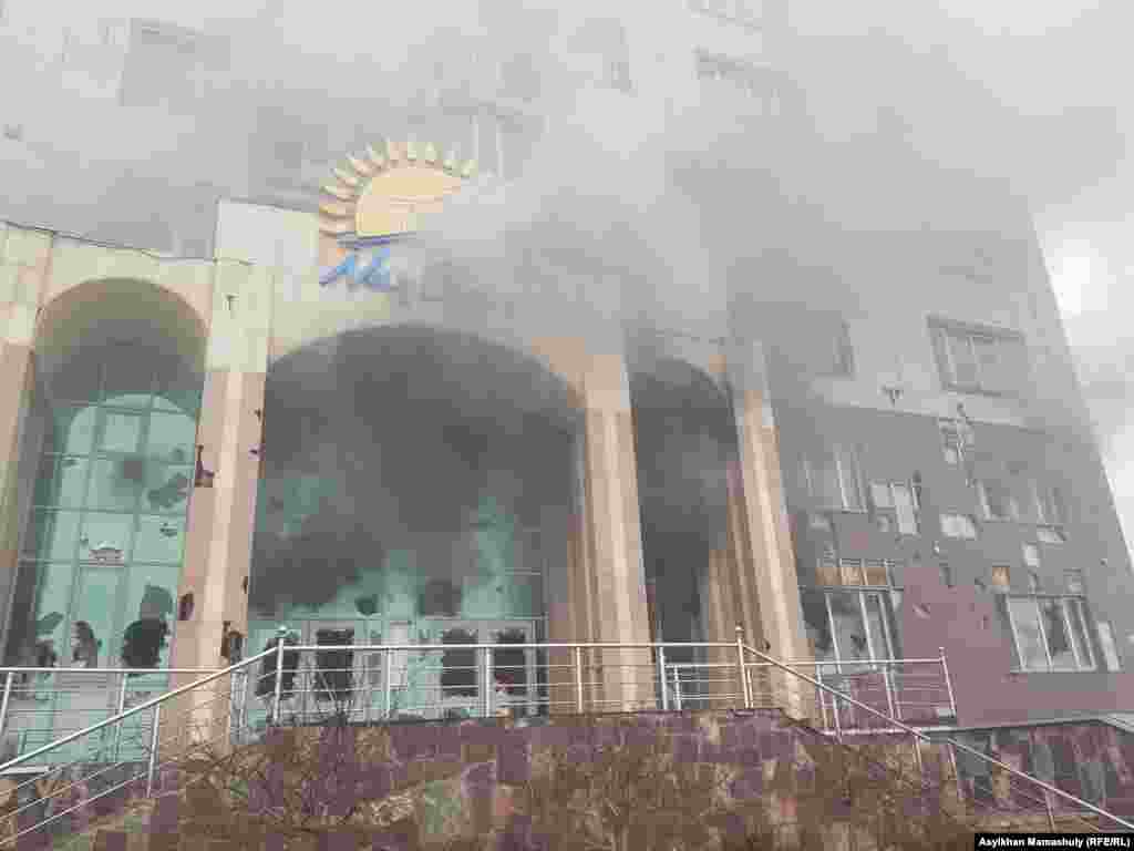 A building housing an Almaty office of Nur Otan, Kazakhstan's ruling political party, burns on January 5. It is not know how the fire started. RFE/RL's Kazakh Service reports that the building was left to smolder, with no policemen or fire trucks seen nearby when this photo was taken. 