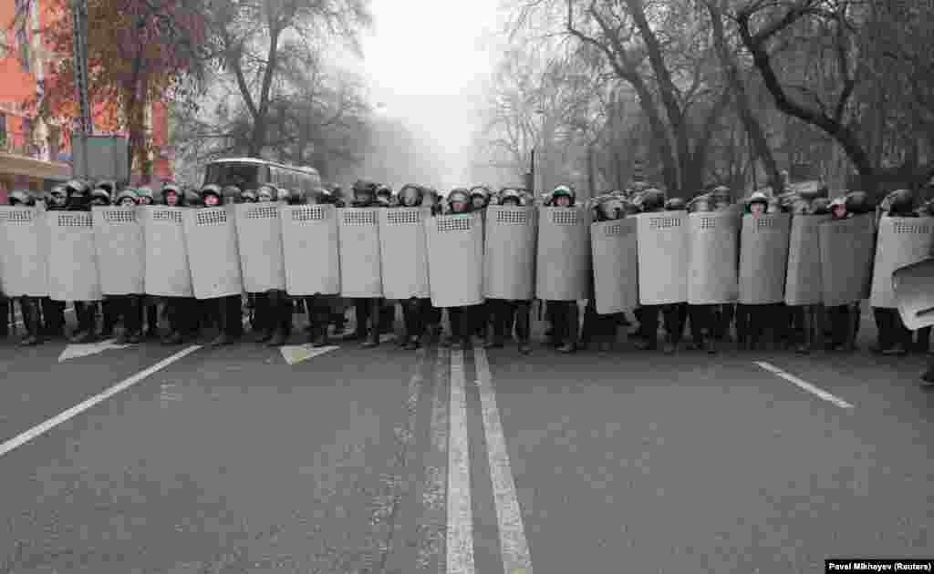 Police form a wall of shields in Almaty on January 5. 
