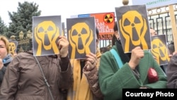 Activists in Bishkek hold a protest against uranium mining in April 2019, the same year that Kyrgyzstan banned the practice after years of campaigning by environmentalists. Now the country's populist president looks set to reverse that decision. 