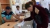 Armenia - A voter in Tsaghkahovit village casts a ballot in a local election, 18Sep2016.