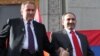 Former Armenian President Levon Ter-Petrosian (left) and Nikol Pashinian greet supporters in Yerevan in 2011.