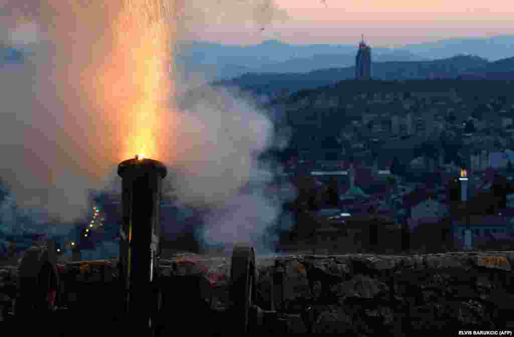 Amid a national lockdown, a cannon overlooking Sarajevo's Old Town is fired on April 23 at sunset to mark the beginning of the holy Muslim month of Ramadan in Bosnia-Herzegovina.