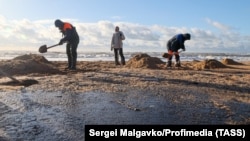 Volunteers help to clean up beaches after a massive oil spill in Russia's Krasnodar region.