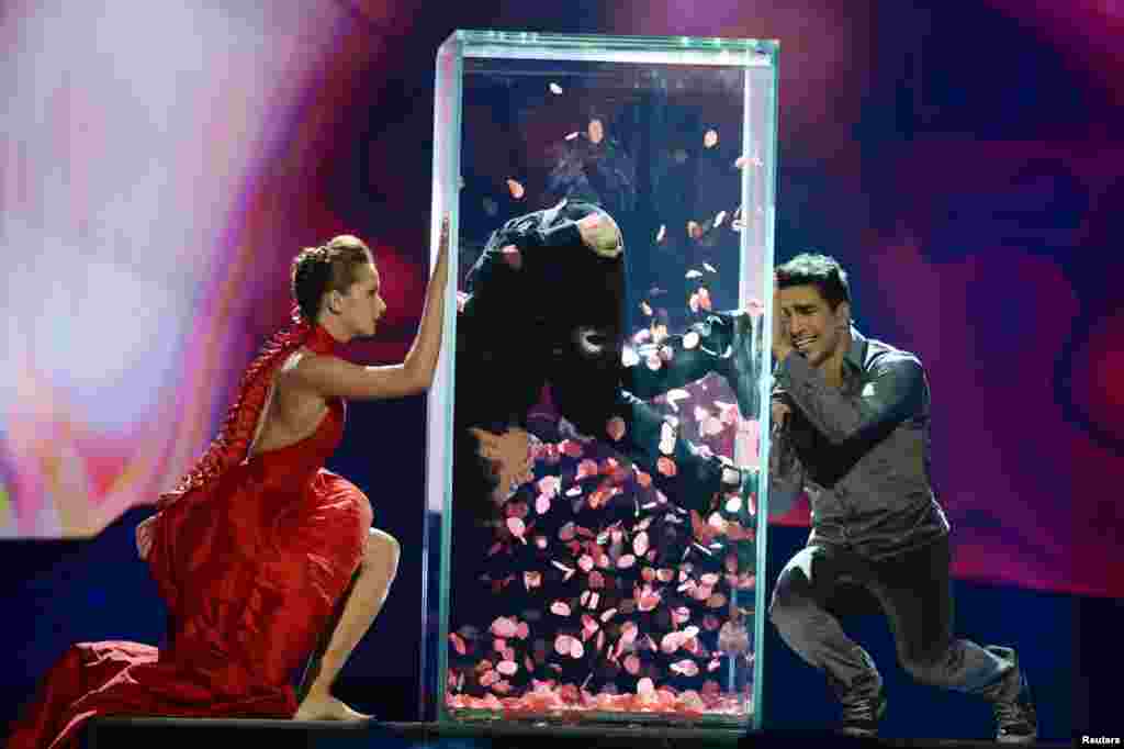 Azerbaijan's contender, Farid Mammadov (right), performs in the final in Malmo, Sweden, in 2013. Oil-rich Azerbaijan came under fire when host country Sweden accused it of attempting to bribe jurors in several countries. The scandal forced Eurovision organizers to revise jury voting for better transparency.