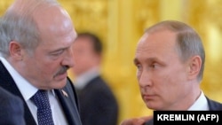 Russian President Vladimir Putin (right) listens to Belarusian President Alyaksandr Lukashenka during a meeting at the Kremlin in Moscow in December 2015.