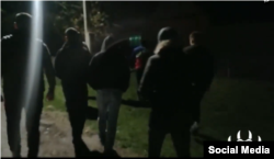 A screenshot from the Facebook video where members of Levijatan confront a man accused by them of organizing dog fights.