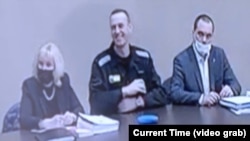 Aleksei Navalny (center) is seen on a video link from inside the Correctional Labor Colony No. 2 in the town of Pokrov, east of Moscow, in February.