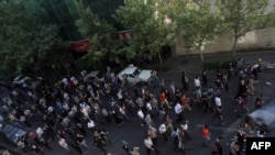 Opposition protestors in the streets of central Tehran weeks after the June election that they dismissed as fraudulent.