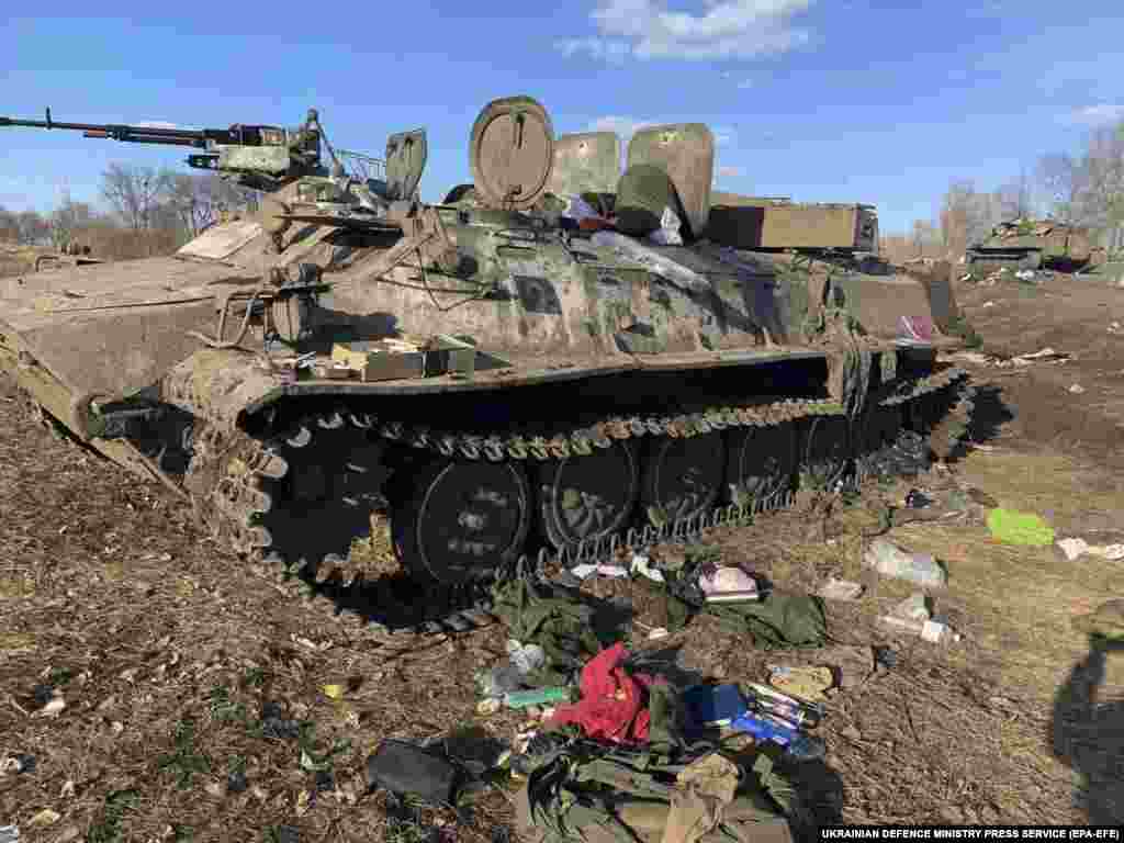 A handout photo from the Ukrainian Defense Ministry shows a damaged Russian armored personnel carrier near Kharkiv on February 24.&nbsp;