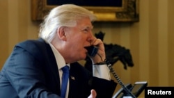 U.S. President Donald Trump speaks to Russian President Vladimir Putin by telephone from the White House in January.