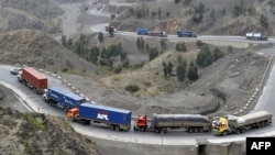 Trucks drive through the mountainous area near Torkham by Afghanistan's border with Pakistan. (file photo)