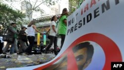 His critics accuse President Mahmud Ahmadinejad of "ignoring the basic principles of economics."