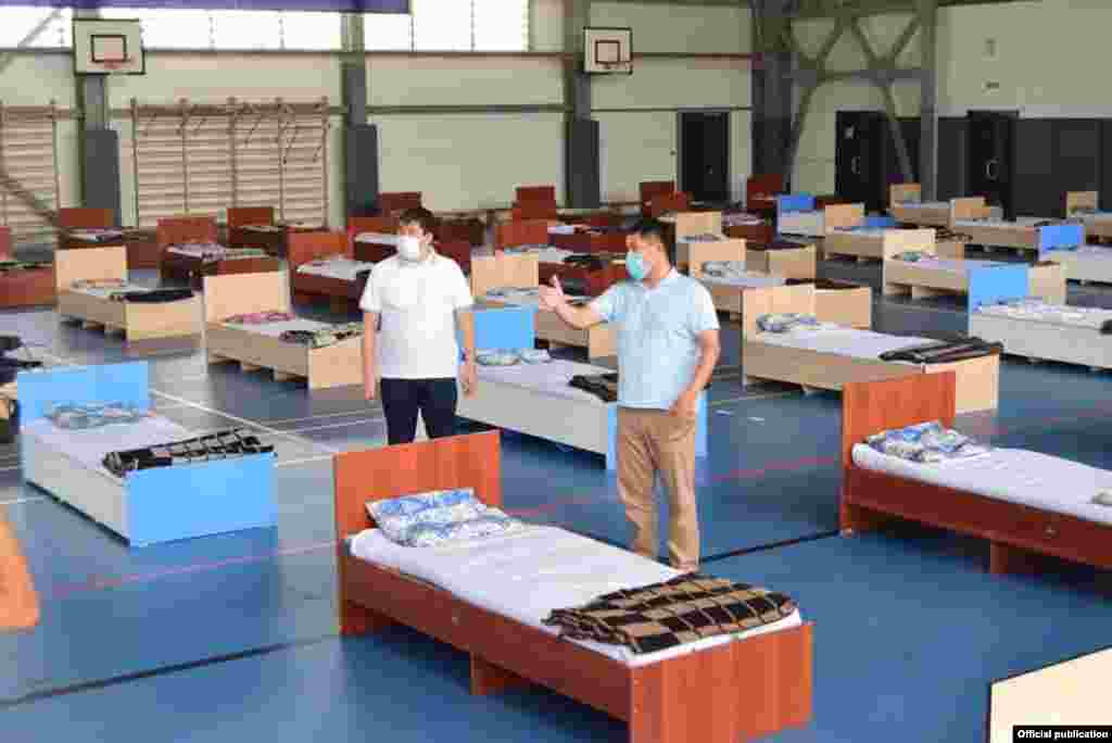 Workers set up a makeshift hospital in a Jalal-Abad gym on July 8. Health officials in the region say they need 300 more oxygen concentrators. Of the 372 concentrators currently available to Kyrgyz doctors, 23 are not working.
