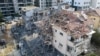 Officials say an Iranian missile damaged buildings in the Israeli city of Ramat Gan near Tel Aviv, June 14, 2025.