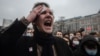 An injured protester expresses his rage at riot police in Moscow on January 23.